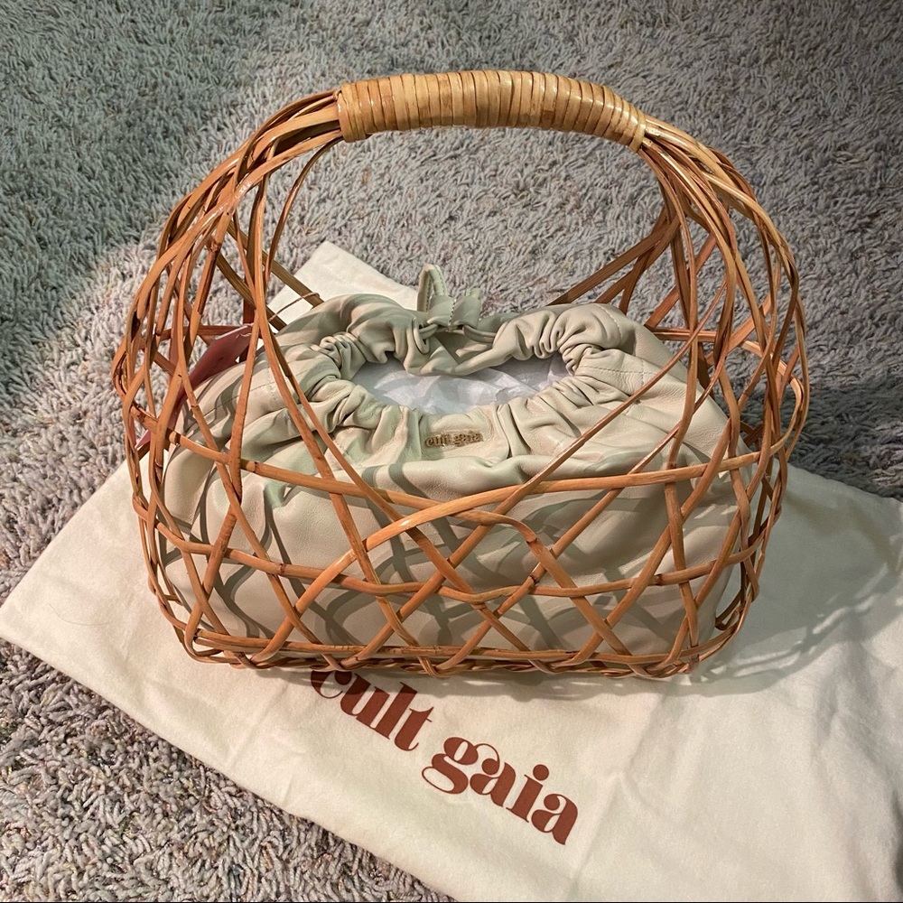 Cult Gaia Aviva tan rattan basket bag with cream leather pouch